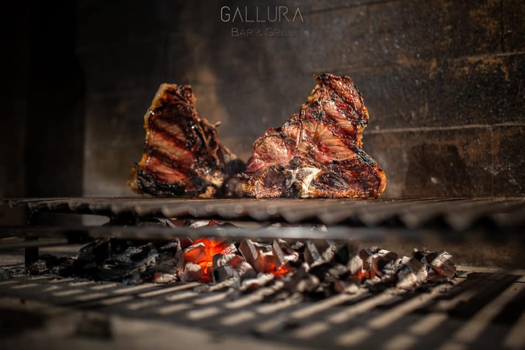 T-bone steaks grilling at Gallura Bar & Grill, Badesi