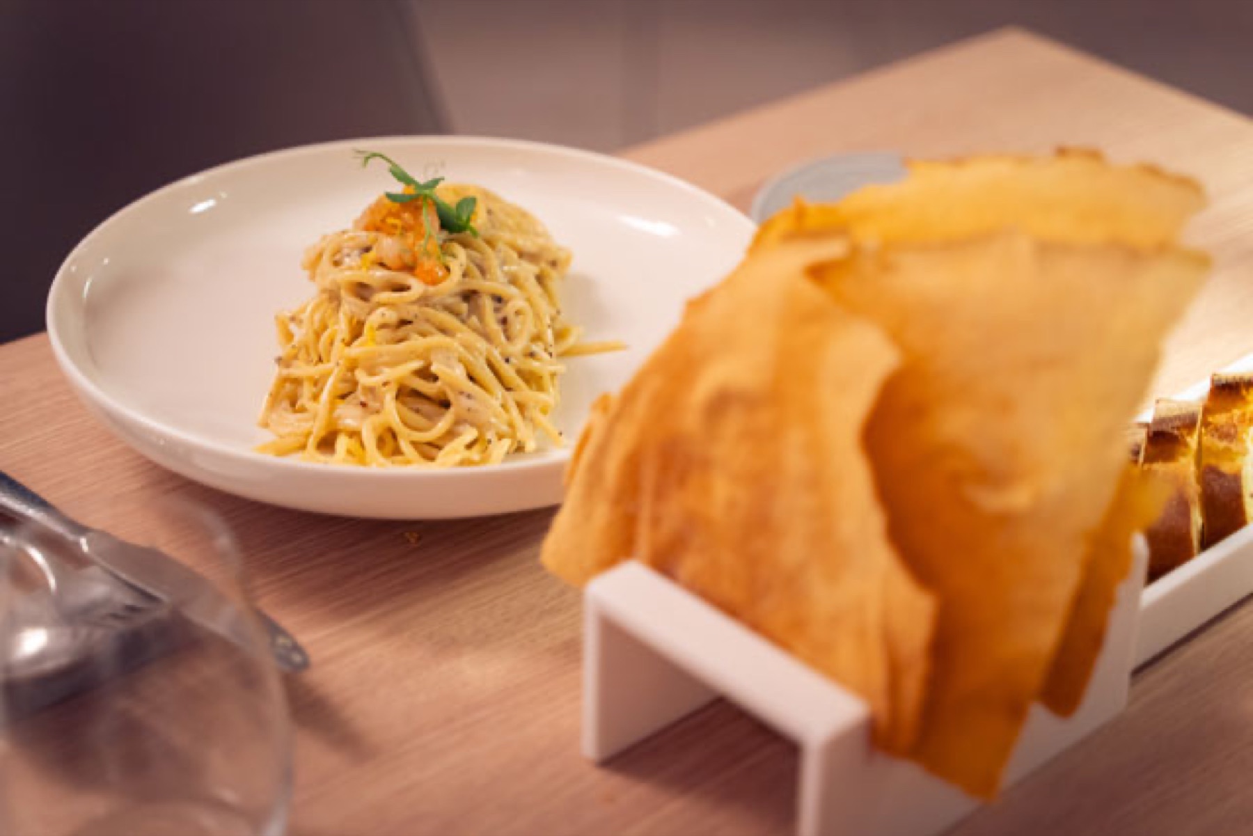 A refined pasta plate at Mesadoria with crisp pane carasau alongside